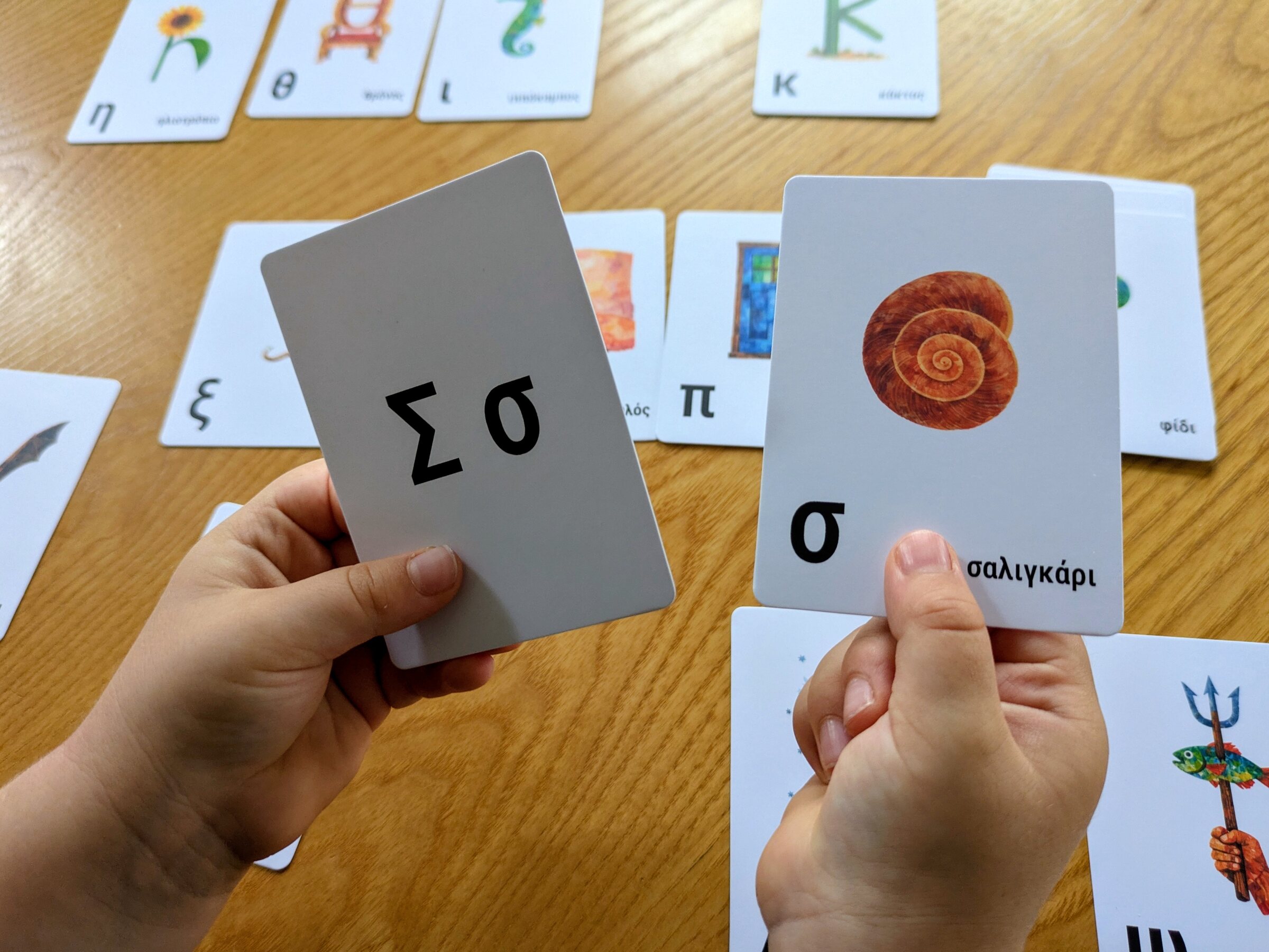 A close-up example showing an object card paired with its corresponding alphabet card