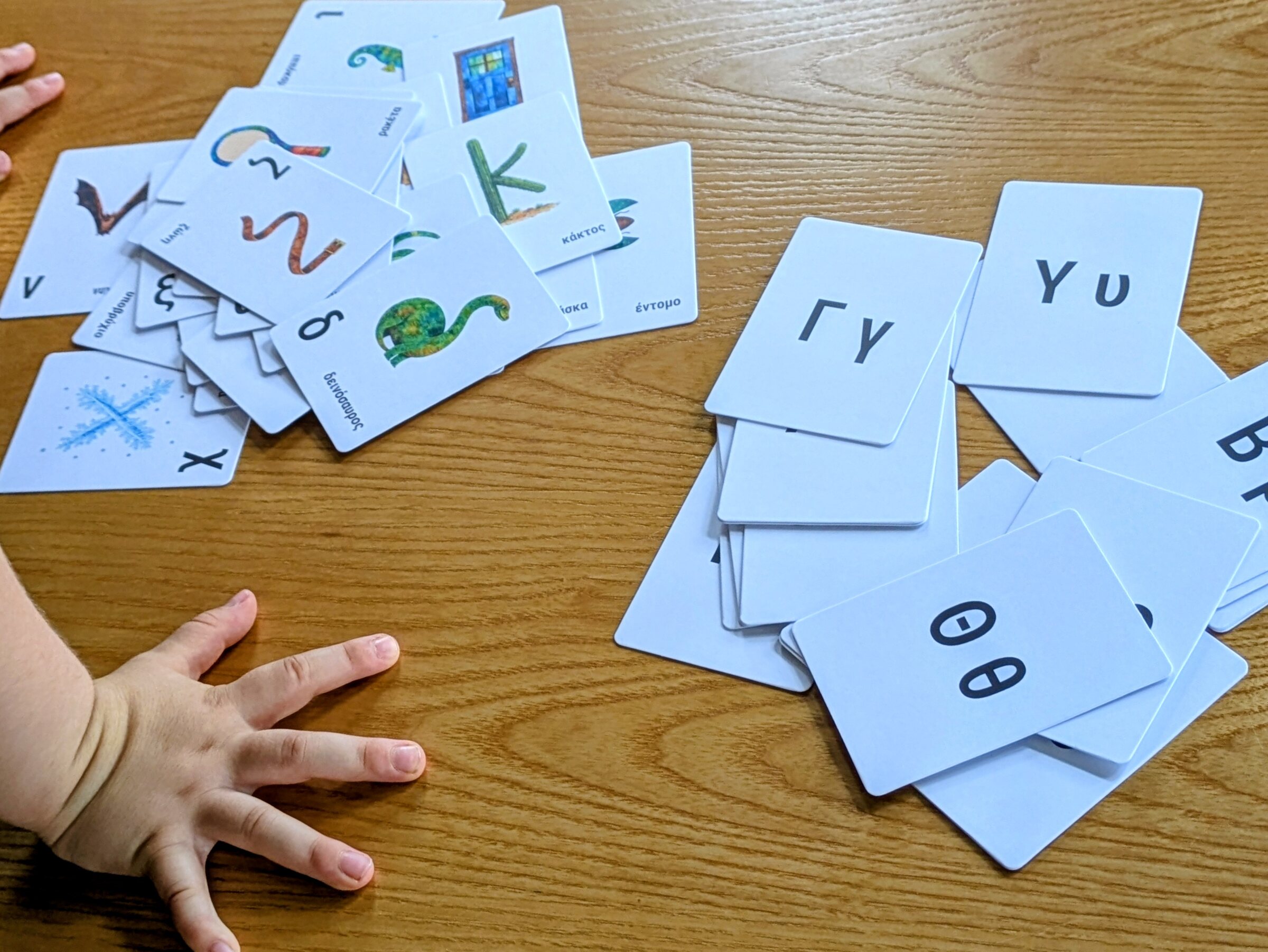 The two sets of cards laid out: object cards and alphabet cards