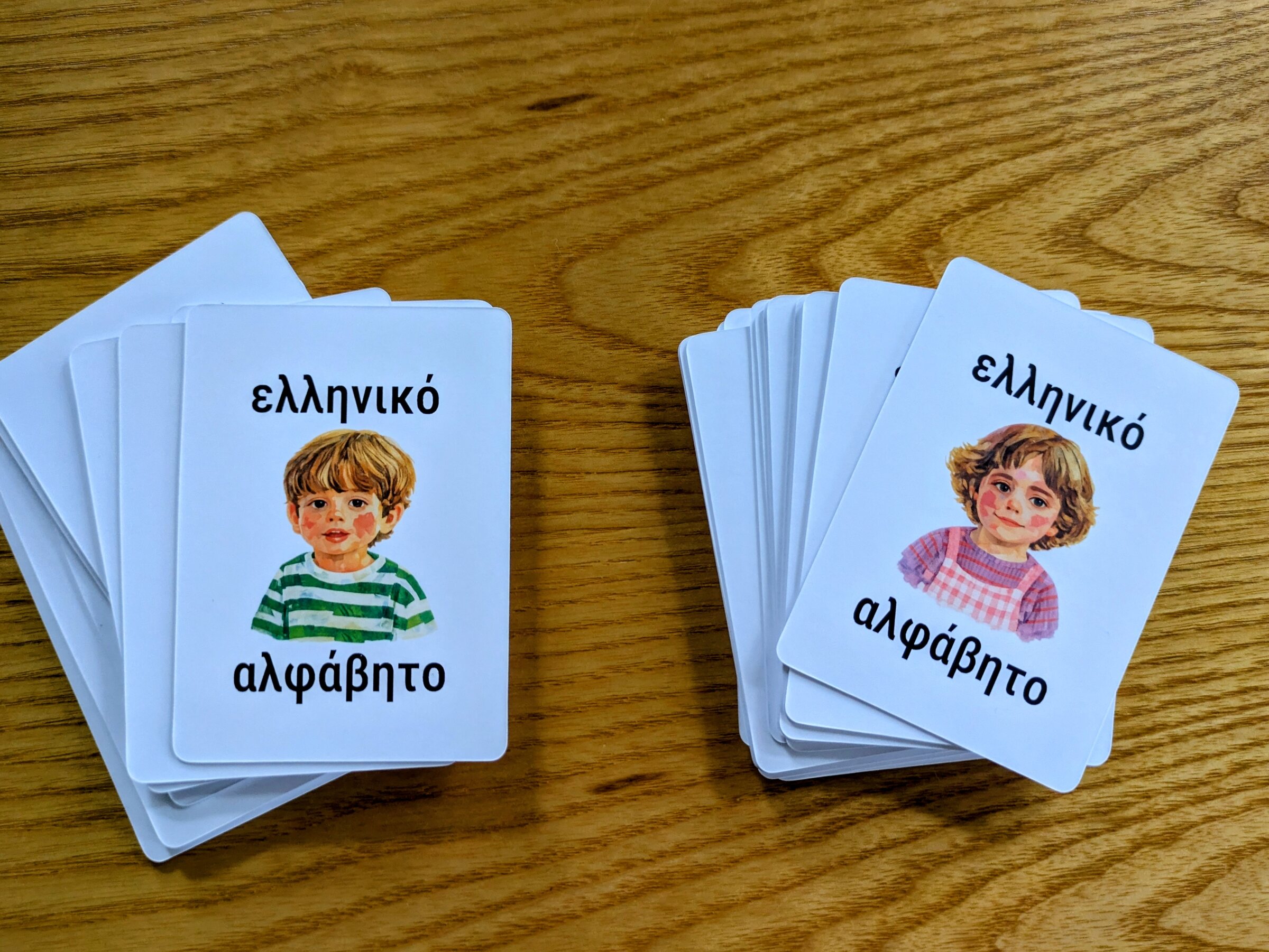 The backs of the two card sets, each featuring one of my children